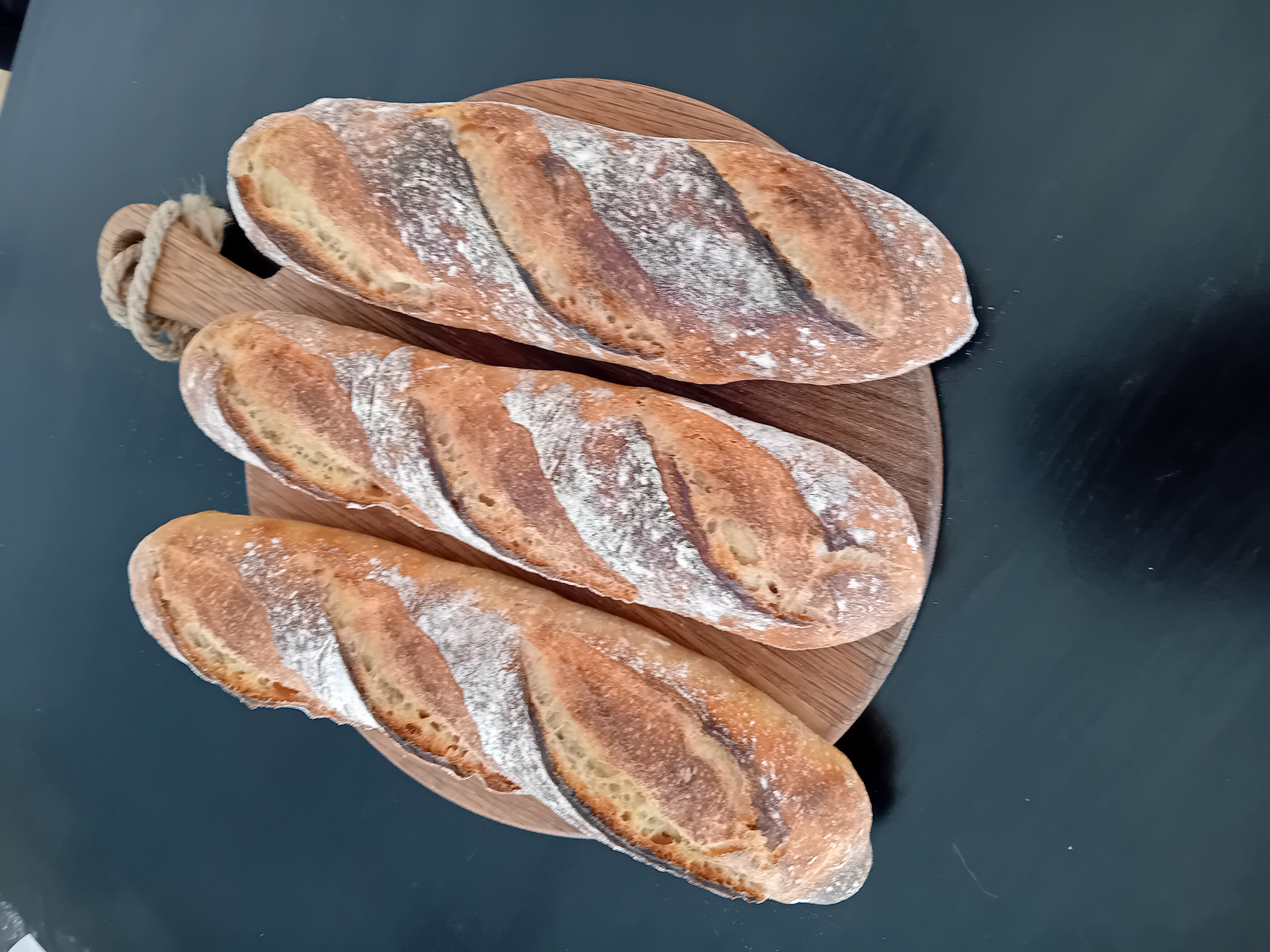 Baguettes on dark board
